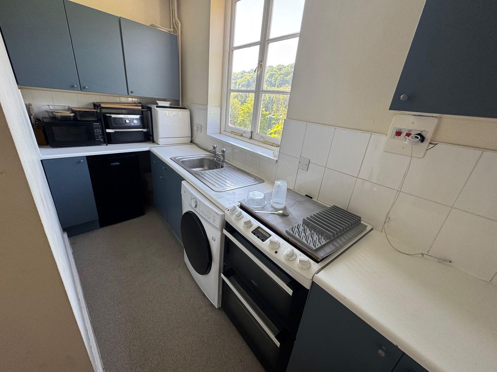 A kitchen with appliances and fixtures at 31 High Street Telford