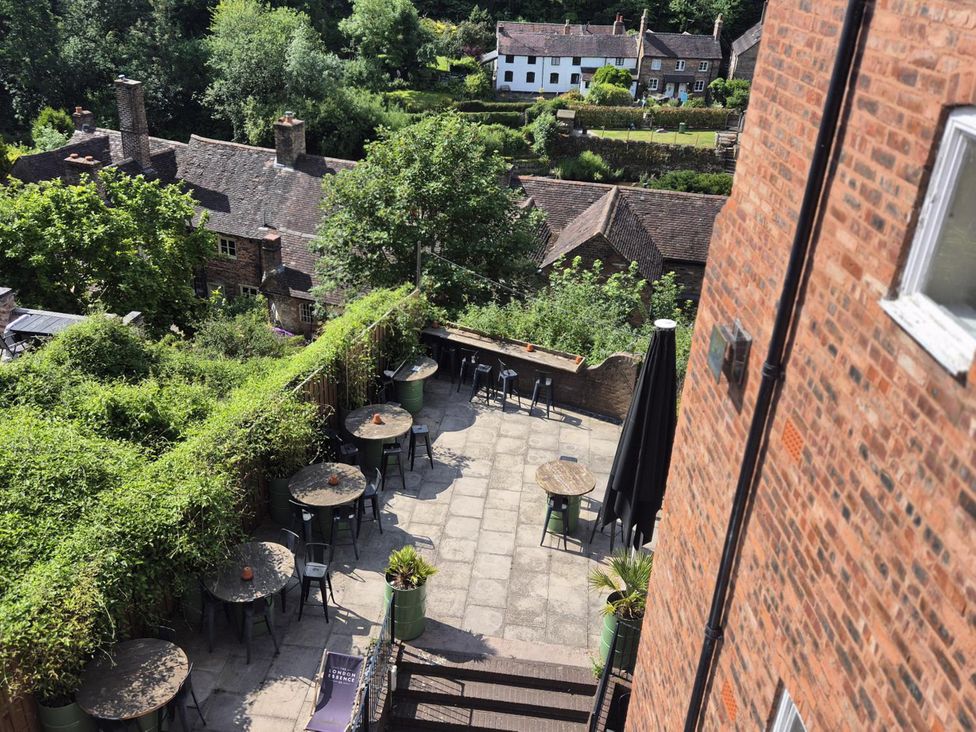 An outdoor seating area with tables and chairs at 31 High Street in Telford