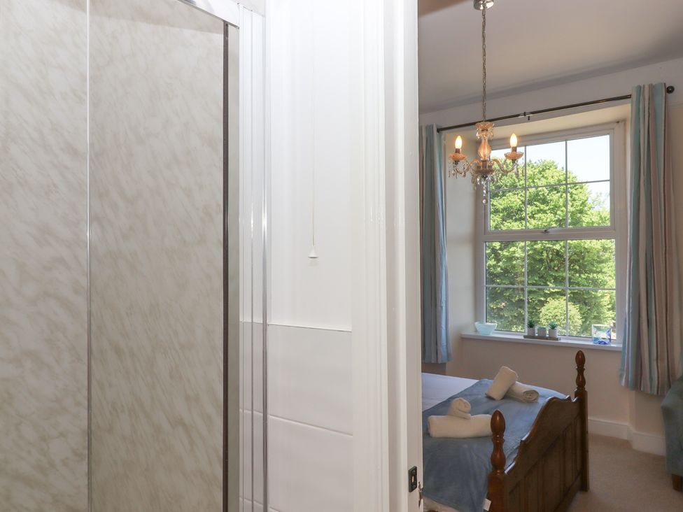 A bedroom with a shower and a view at Littleham Court Manor Littleham near Bideford