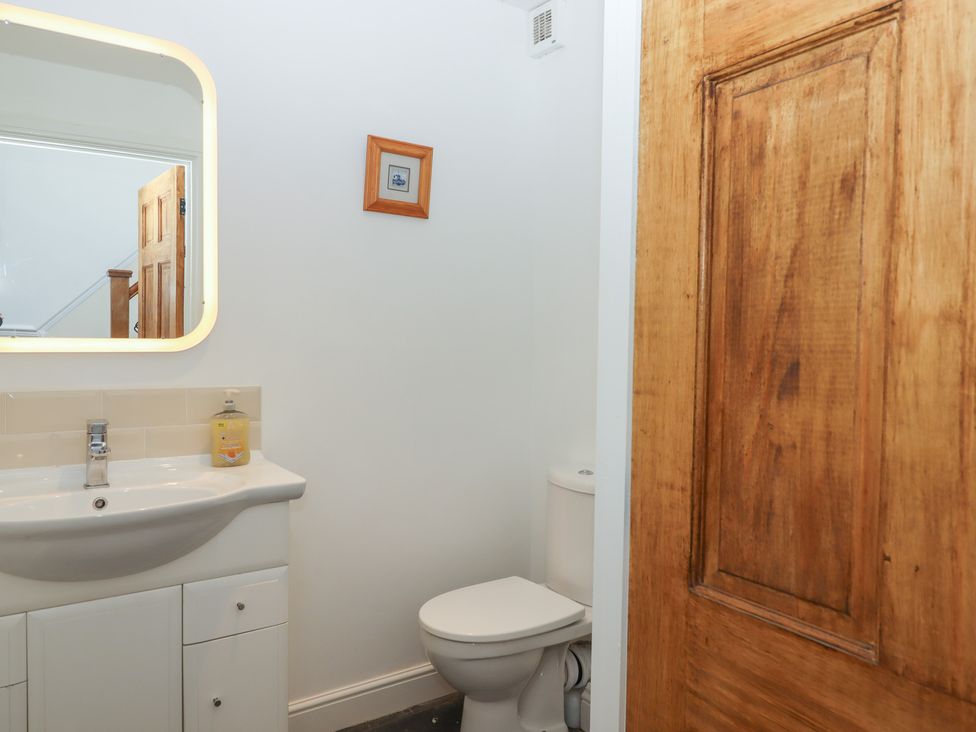 A bathroom with a sink and toilet at Littleham Court Manor Littleham near Bideford