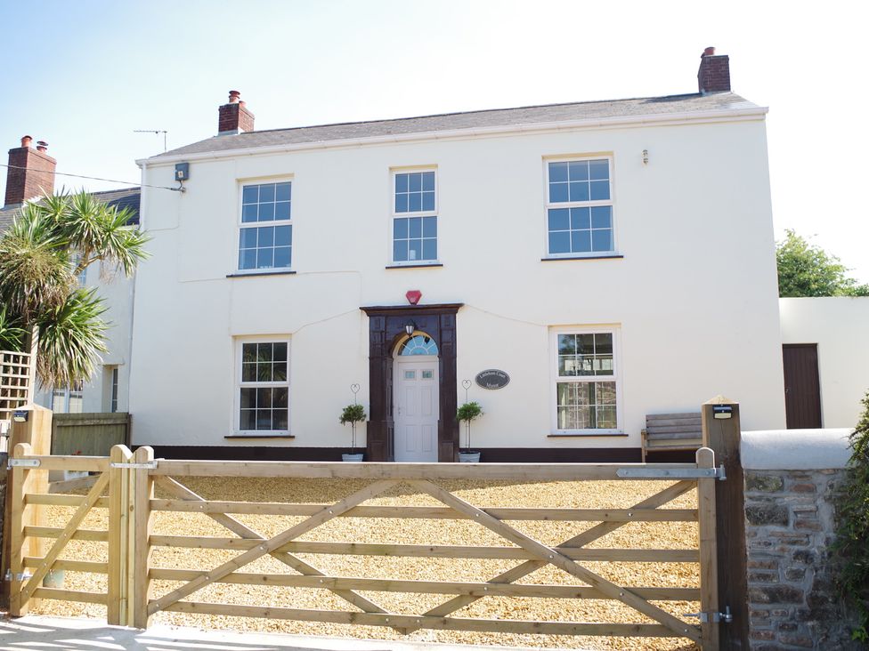 A house with an entrance and gate at Littleham Court Manor Littleham near Bideford