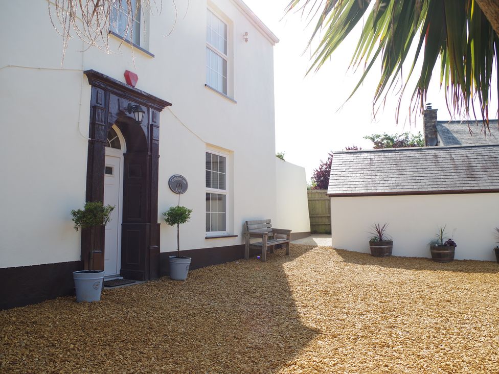 An outdoor area with a door and window at Littleham Court Manor in Littleham near Bideford