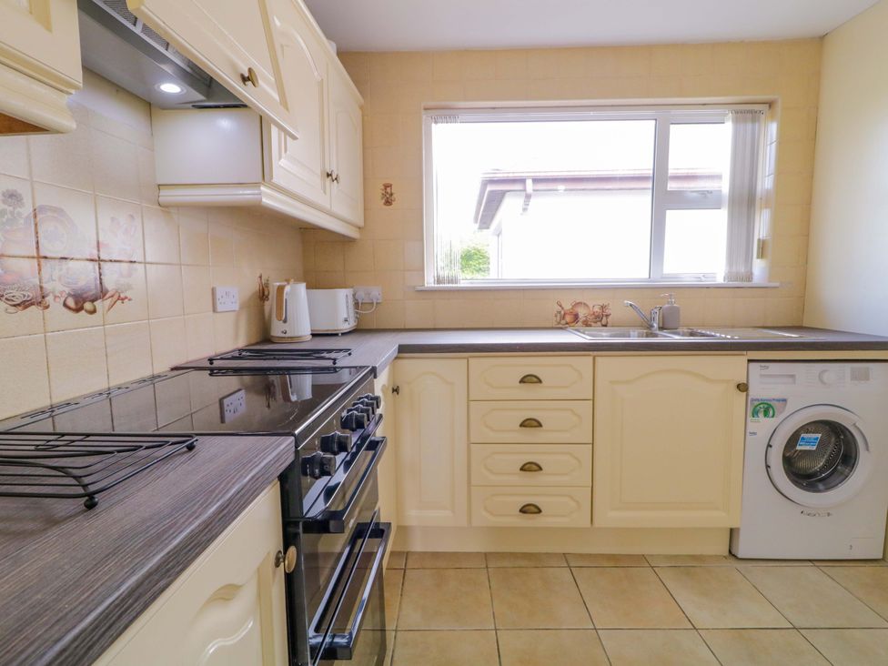 A kitchen with stove, oven, kettle and sink at Ard Na Mara in 