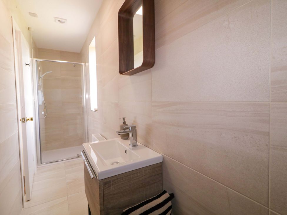 A bathroom with a sink and shower at Ard Na Mara 