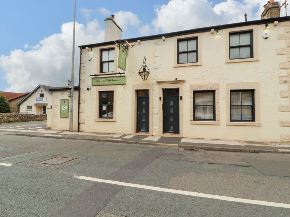 A building with doors and windows at Taps on the Green in Carnforth