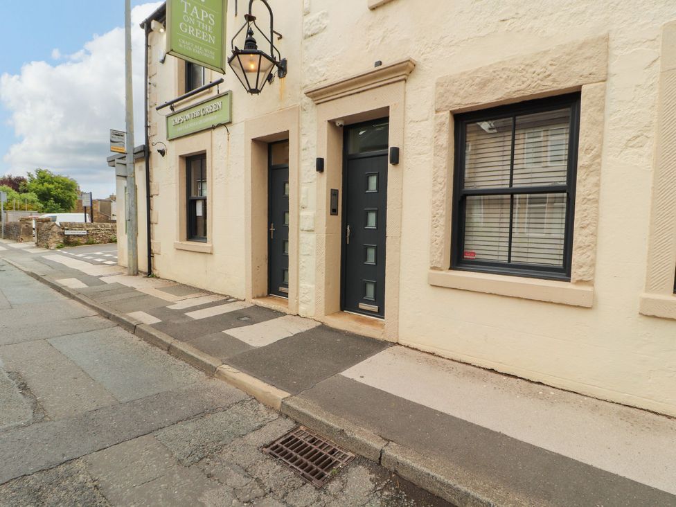 A building exterior with doors and windows at Flat 1 Carnforth