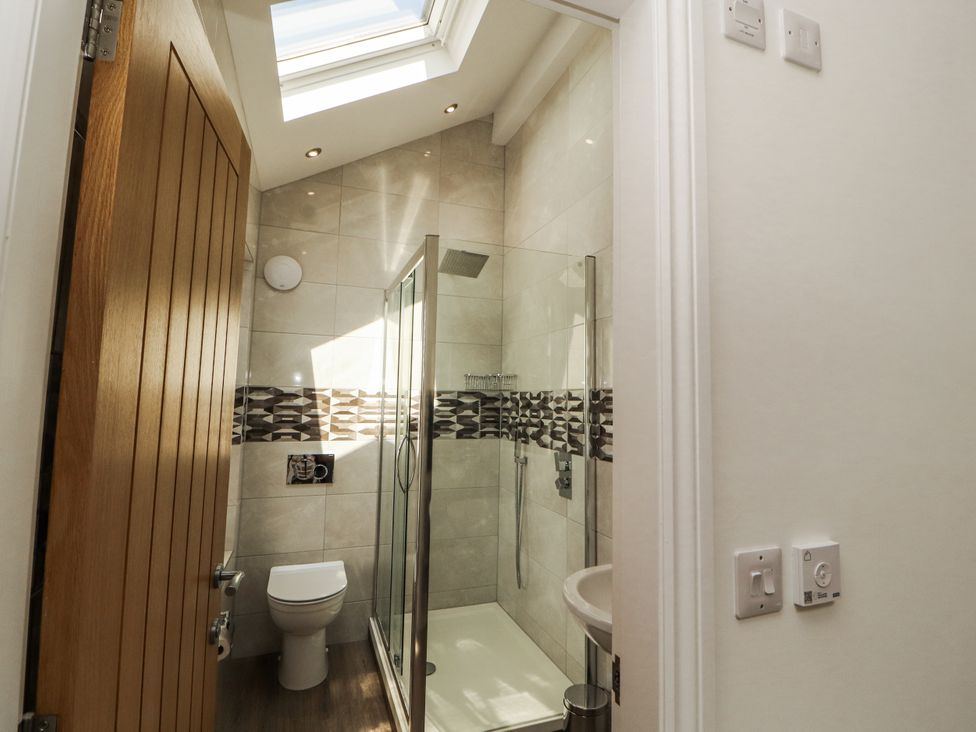 A bathroom with a shower and toilet at Flat 2 in Carnforth