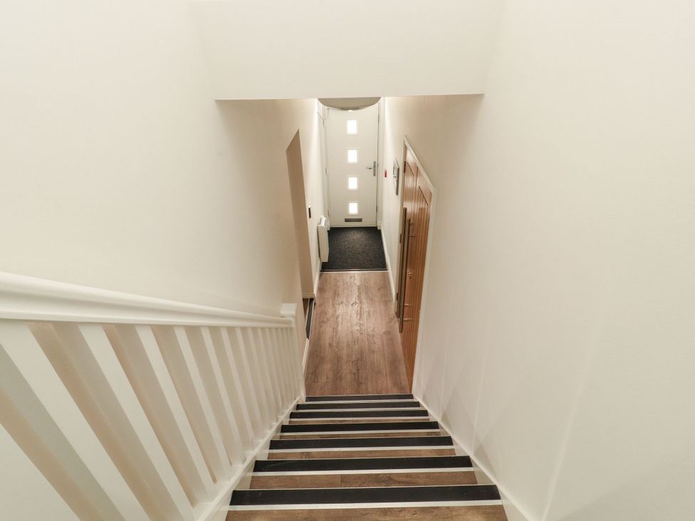 Stairs leading to a front door at Flat 3 in Carnforth