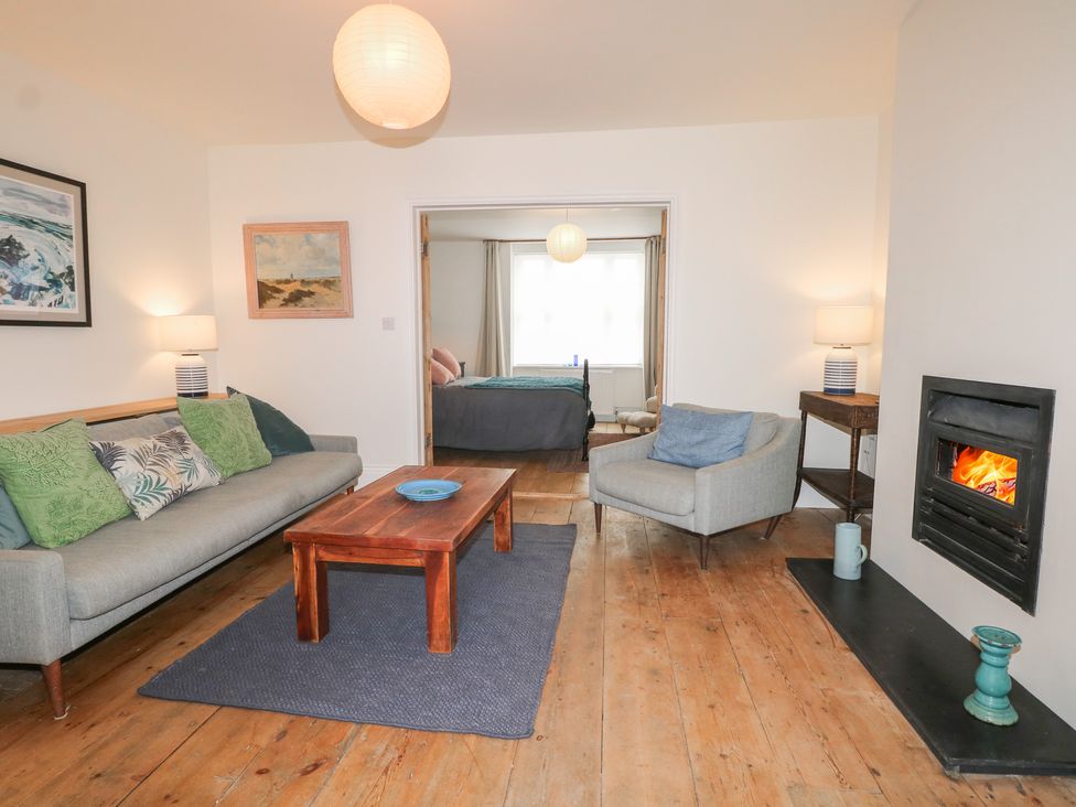 A living room with a sofa and coffee table at Lower Floor Flat in 