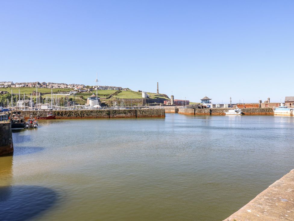 A harbor with boats and buildings at Lowther House, Whitehaven