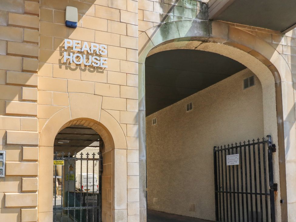 An entrance archway with a sign reading Pears House at Pears Suite Whitehaven