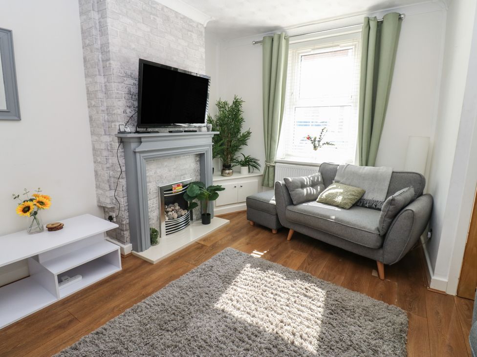 A living room with a television and sofa at Lonsdale Street