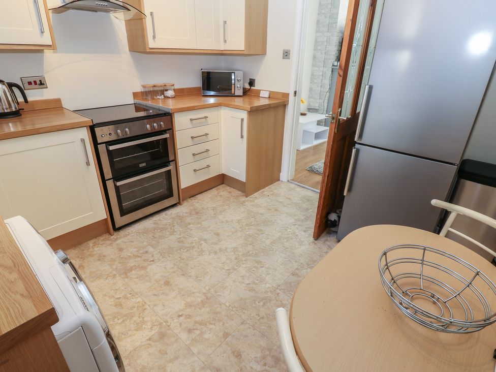 A kitchen with cabinets and appliances at Lonsdale Street