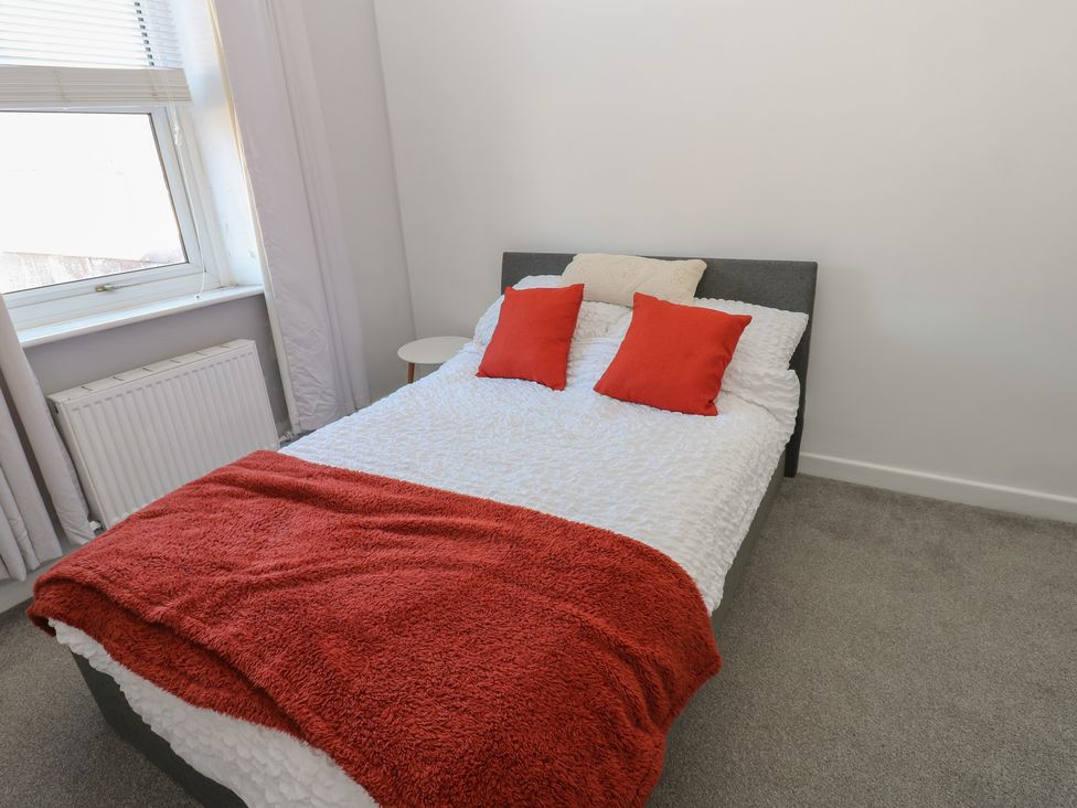 A bedroom with a bed and pillows at Lonsdale Street 