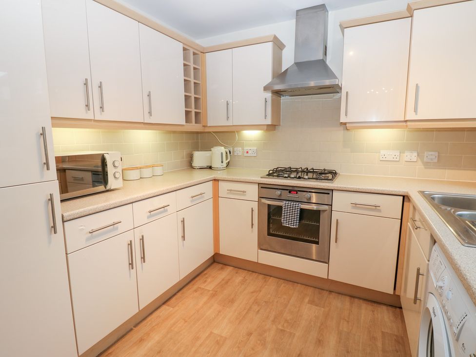 A kitchen with a microwave and oven at Lingla House in Frizington