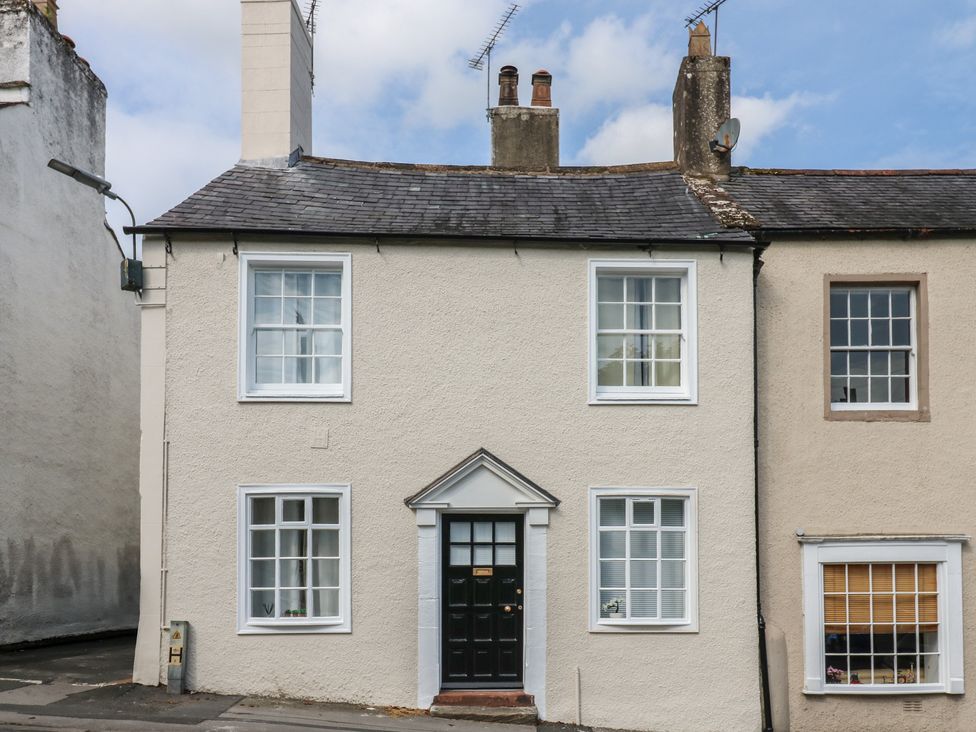 A house exterior with windows and a door at Kirkgate Cottage Cockermouth