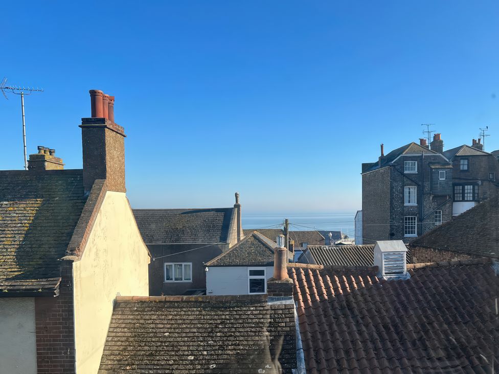 A view of rooftops with the sea in the background at Corner View in Broadstairs