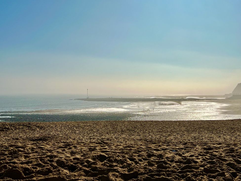 A beach with sand and a view of the sea at Corner View in Broadstairs