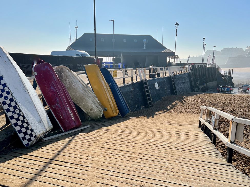 A pier with boats and wooden planks at Corner View in Broadstairs