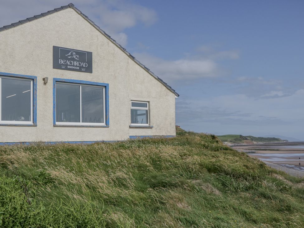 A house with a sign on the wall at Beachroad in St Bees