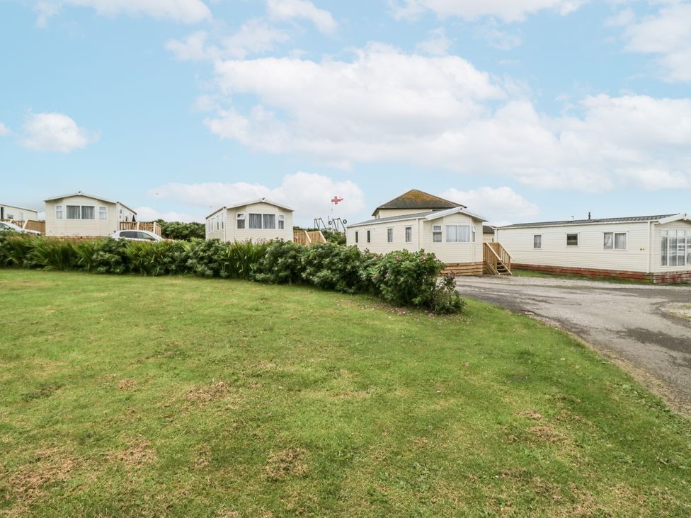 A row of caravans on grass at Puffin in St Bees