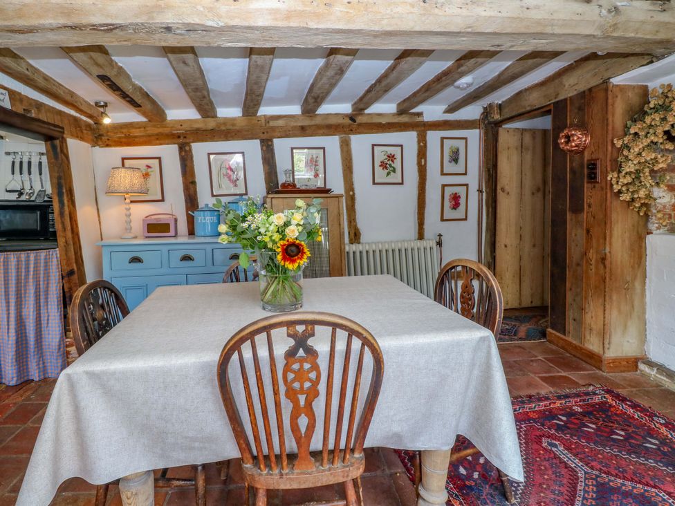 A dining room with a table and chairs at Bank House