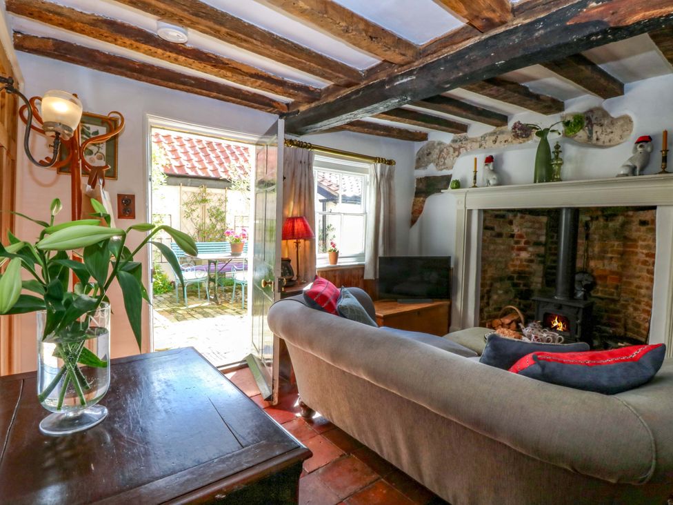 A living room with a sofa and a television at Bank House in 