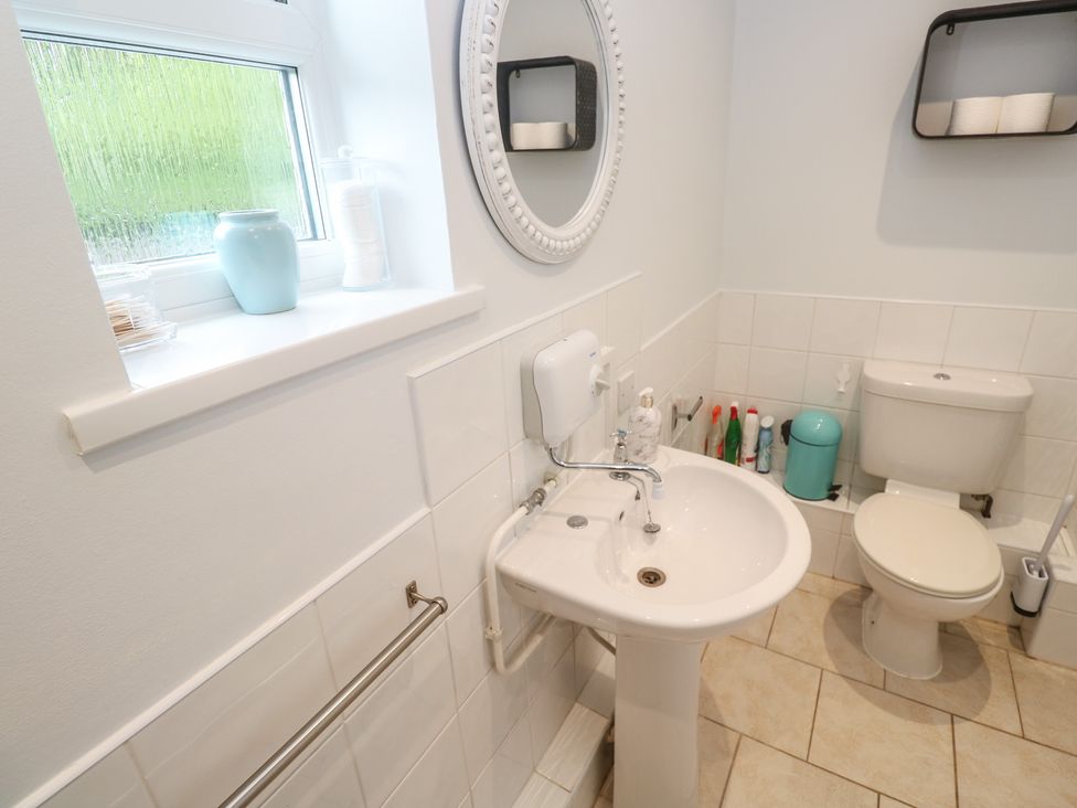 A bathroom with a sink and toilet at Mini Mena in St Austell