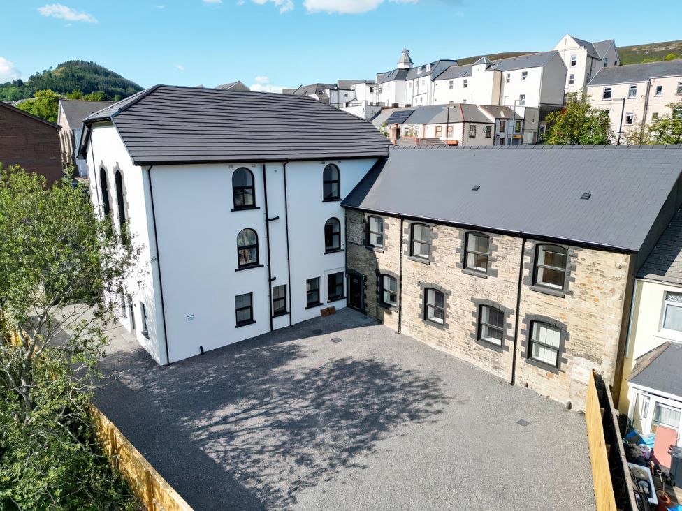 An outdoor area with buildings and a parking space at Tirpentwys in Abertillery