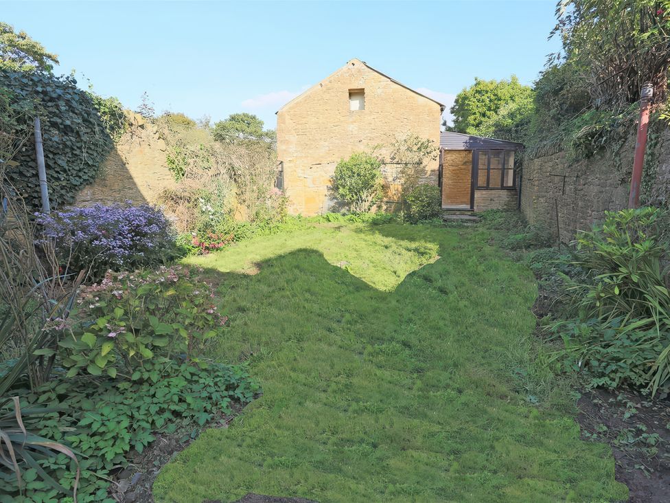 A garden with grass and flowers at 46 North Street Stoke-Sub-Hamdon, Somerset