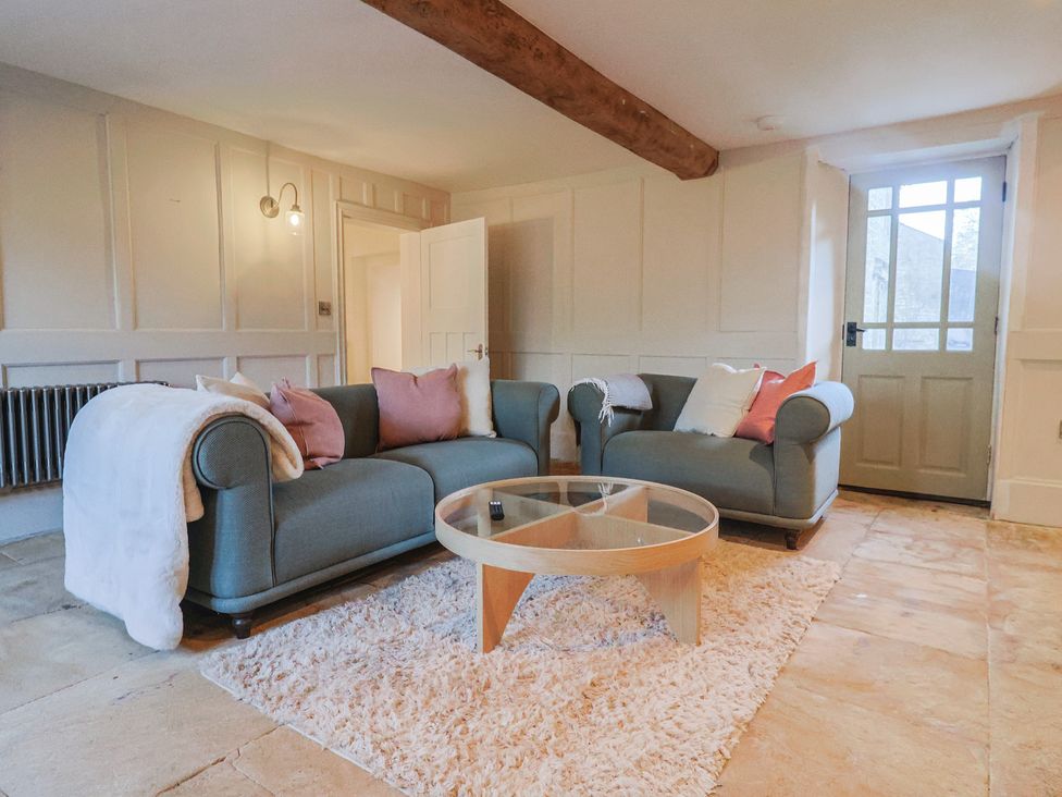 A living room with a sofa and coffee table at 46 North Street, Stoke-Sub-Hamdon, Somerset