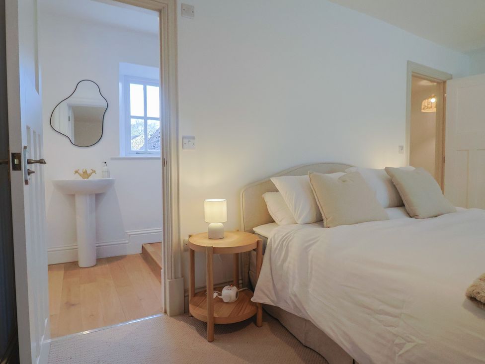 A bedroom featuring a bed and bedside table at 46 North Street, Stoke-Sub-Hamdon, Somerset