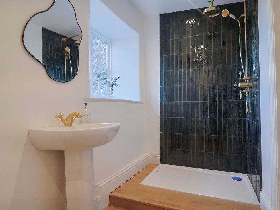 A bathroom with a sink and shower at 46 North Street Stoke-Sub-Hamdon Somerset