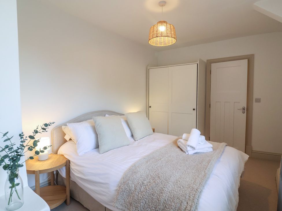 A bedroom with a bed and wardrobe at 46 North Street Stoke-Sub-Hamdon Somerset