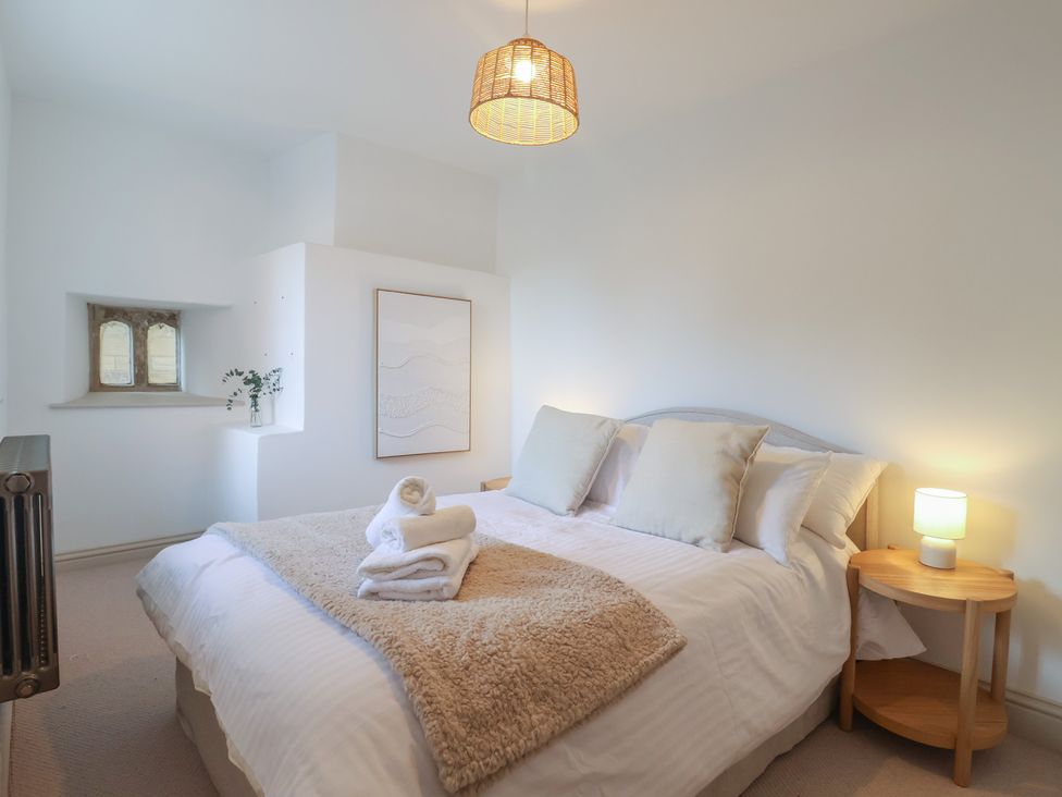 A bedroom with a bed and artwork at 46 North Street, Stoke-Sub-Hamdon, Somerset