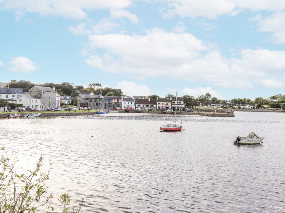 A view of boats on water with houses in the background at Kate's Cottage in 