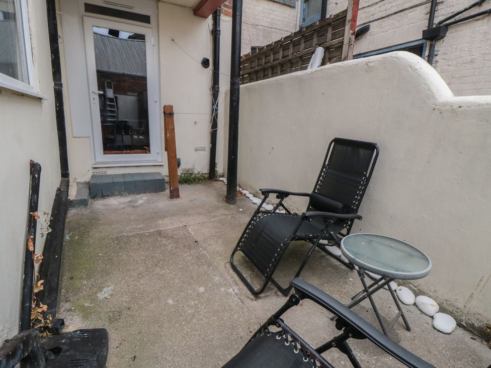 An outdoor area with chairs and a table at 170 Victoria Road