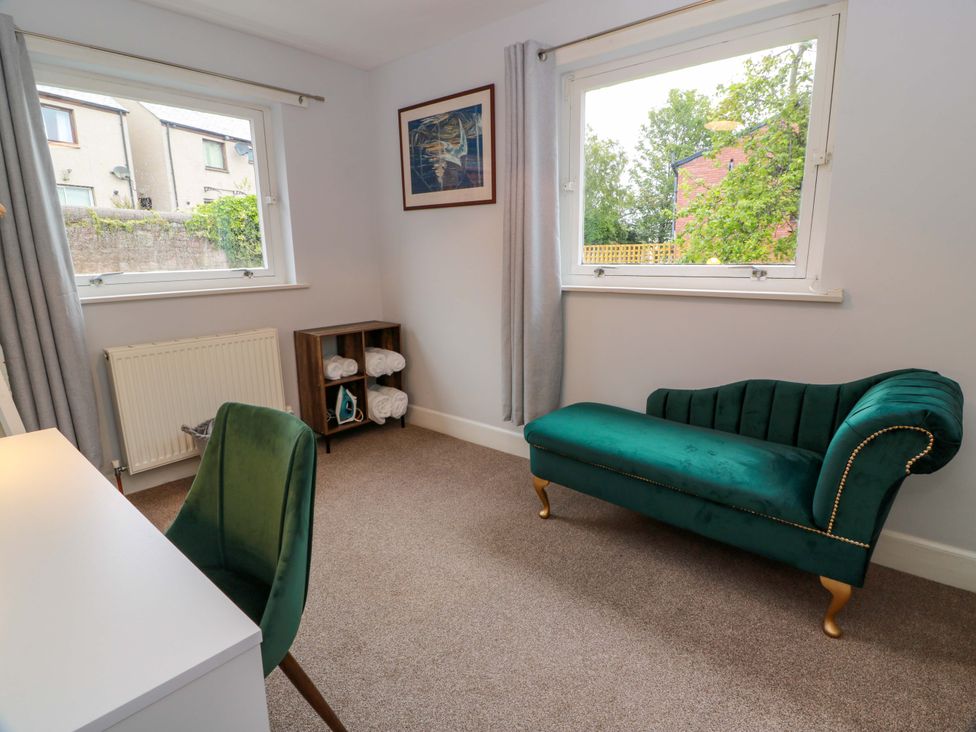 A bedroom with a desk and chair at Secret Garden @ 7