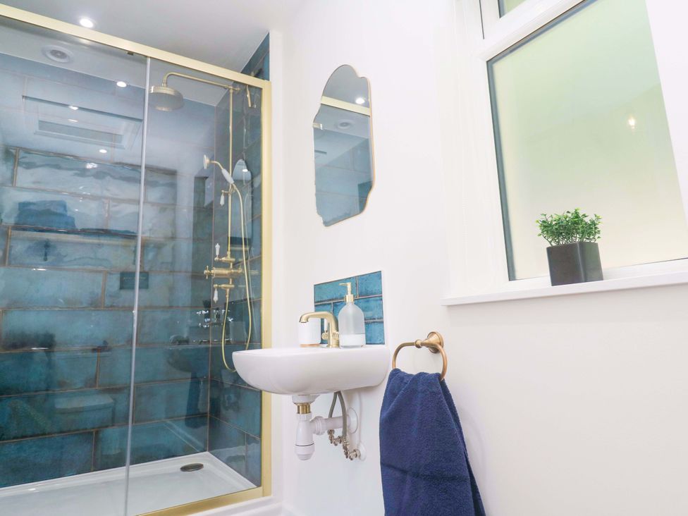 A bathroom with a shower and sink at Lavender Cottage