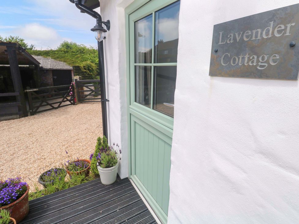 An entrance with a door and nameplate at Lavender Cottage