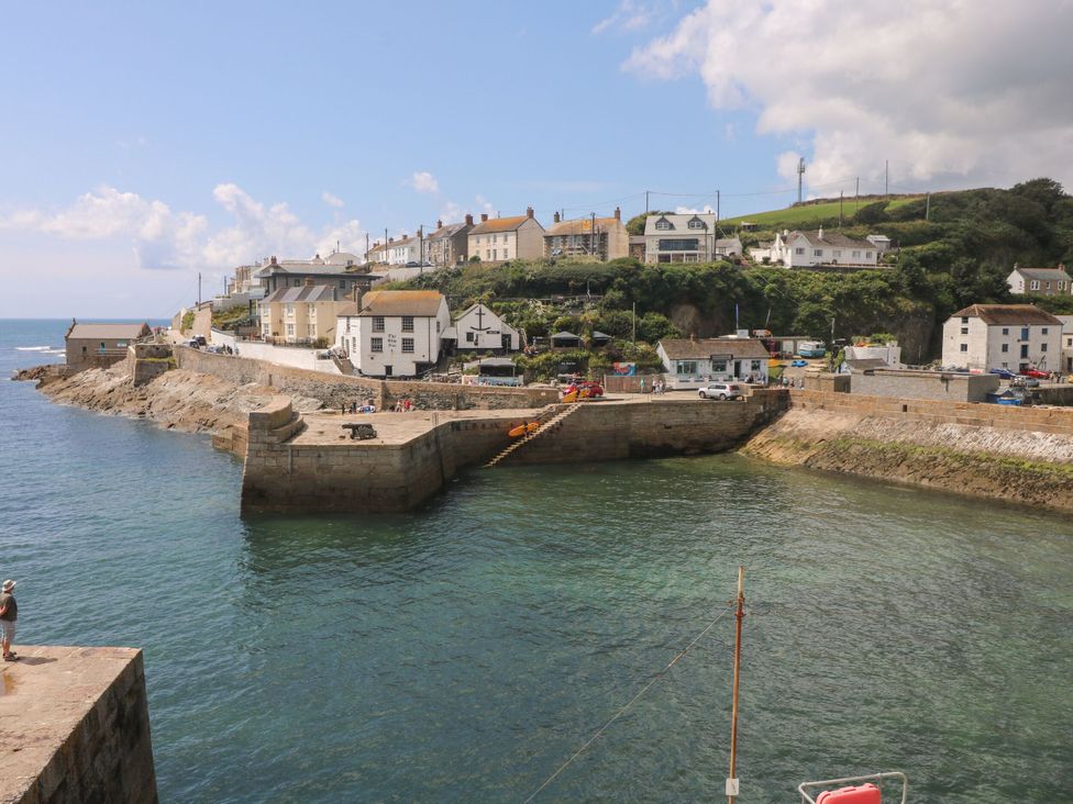 A harbor with boats and buildings near the coast at Lavender Cottage