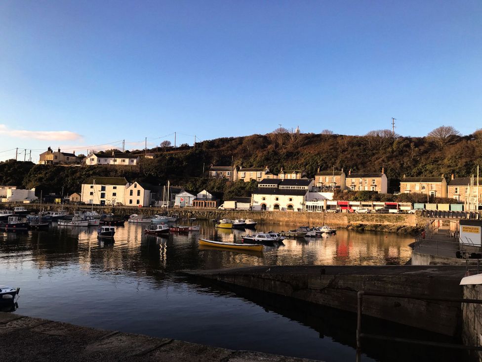 A harbor with boats and buildings at Lavender Cottage in 