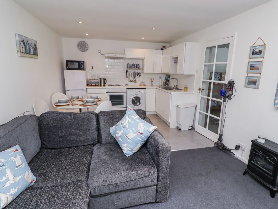 A kitchen with appliances and furniture at 51 Longstone Park