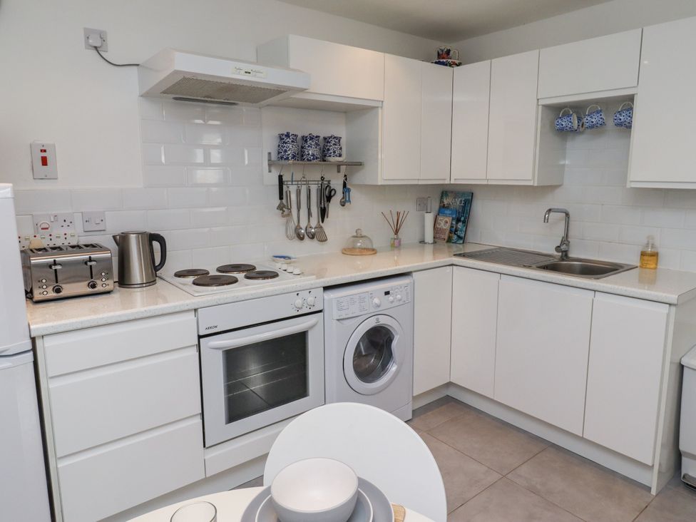A kitchen with modern appliances at 51 Longstone Park