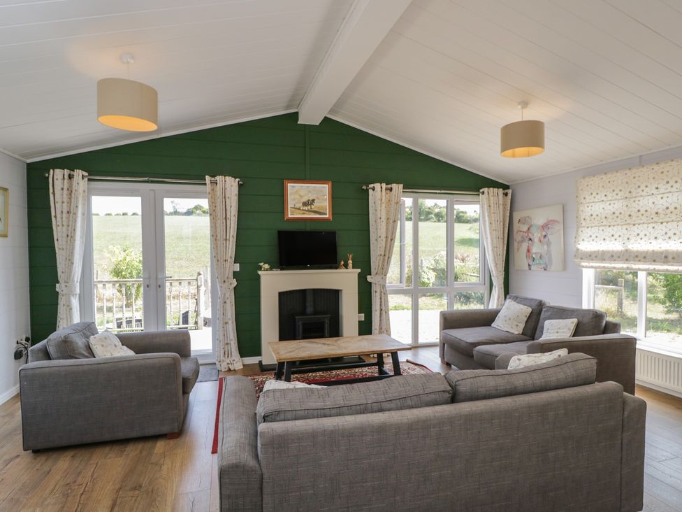 A living room with a coffee table and sofa at The Buckland in Pentridge near Sixpenny Handley