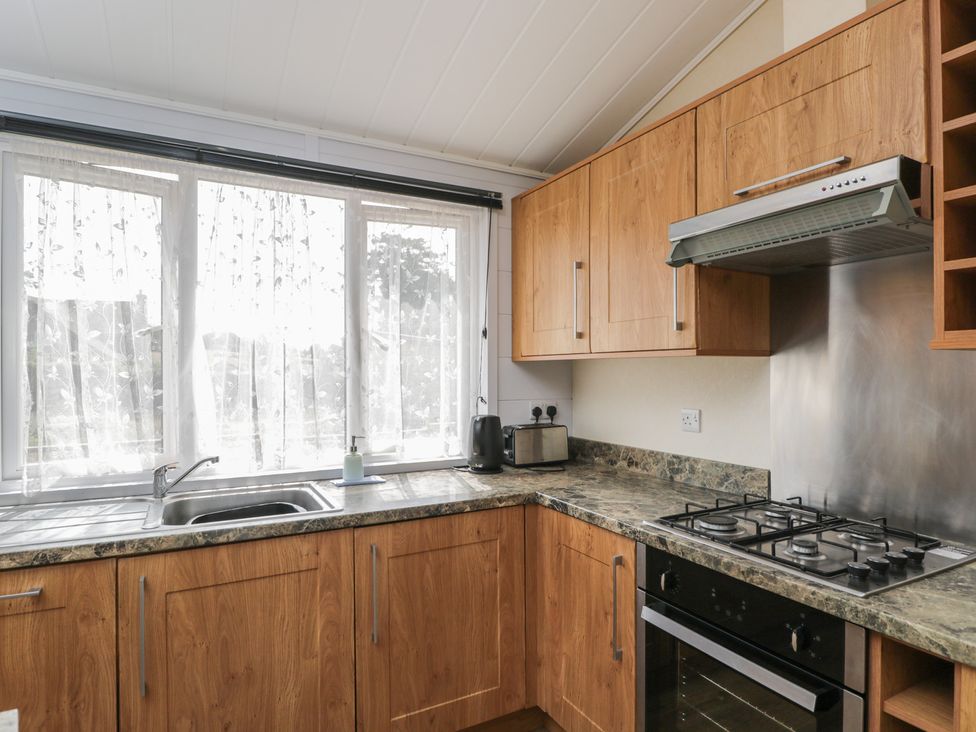 A kitchen with cabinets and appliances at The Buckland in Pentridge near Sixpenny Handley