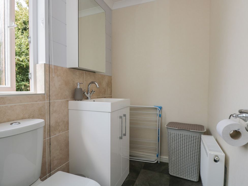 A bathroom with a toilet and sink at The Buckland in Pentridge near Sixpenny Handley