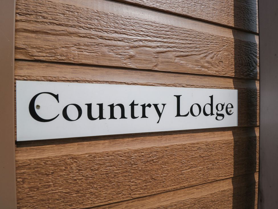 A sign reading Country Lodge at Whitey Top Country Lodge Pentridge near Sixpenny Handley
