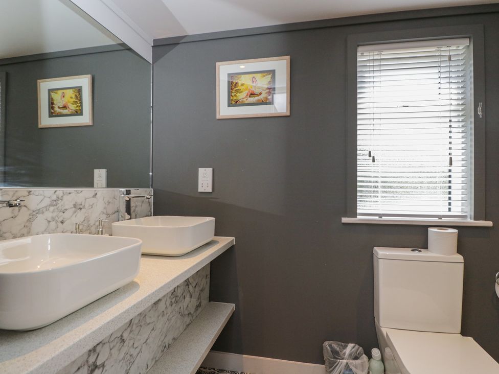 A bathroom with a sink and toilet at Cranborne Chase Stargazer in Pentridge near Sixpenny Handley