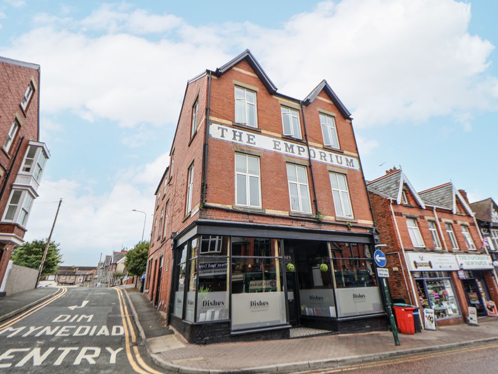 A view of The Emporium building on a street at No 2 Emporium Apartments Prestatyn